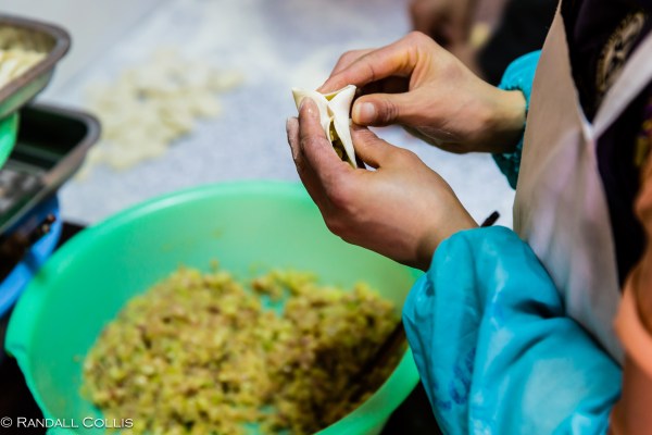 2.  Artfully distribute the fill as you begin the process of pinching together the sides of the dumpling…